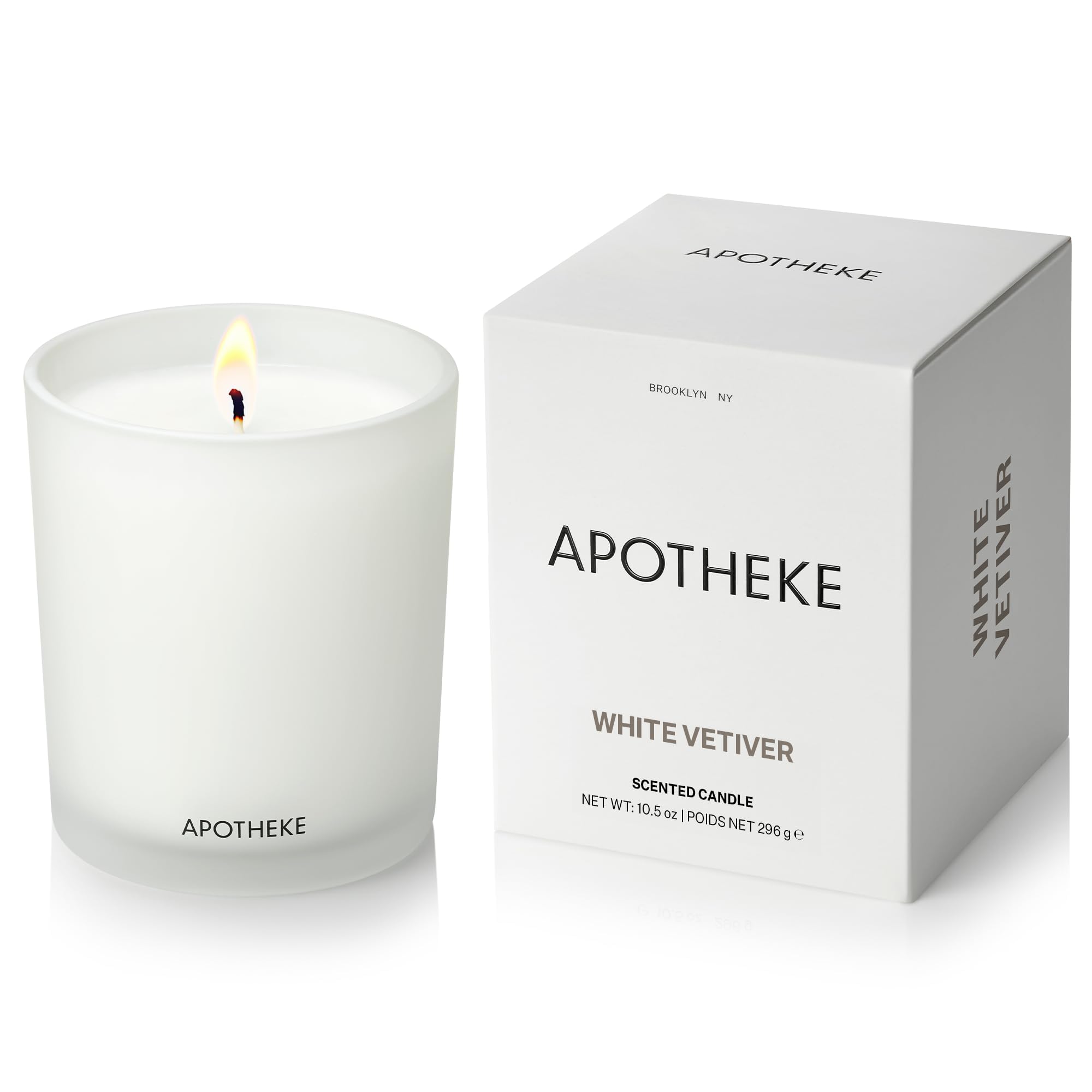 APOTHEKE White Vetiver Candle jar enhances home ambiance with timeless glass design.