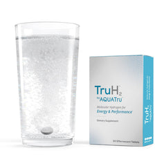 AquaTru TruH2 tablet dissolving in water releasing nano-bubbles for quick pre-workout energy.