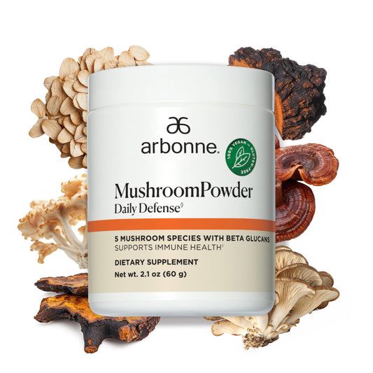 Arbonne Daily Defense bottle with mushroom powder for daily immune support.