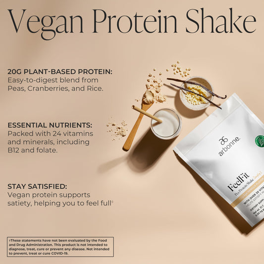 Arbonne Feelfit Vanilla scoop beside powder, ready for a quick vegan shake.