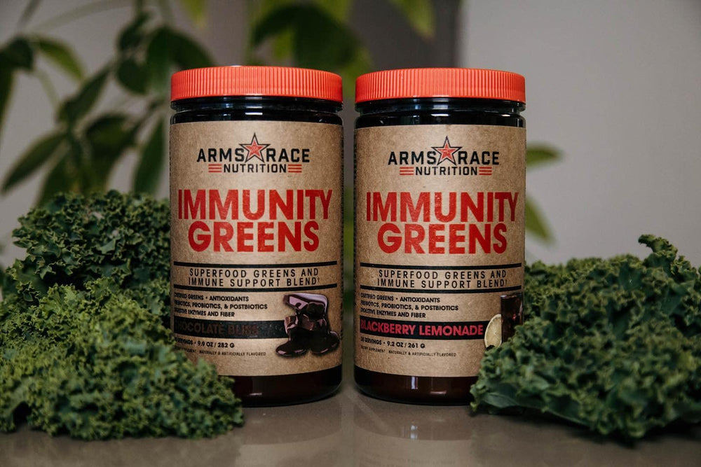 Arms Race Immunity Greens powder scoop blends quickly with a Pineapple Mango beverage