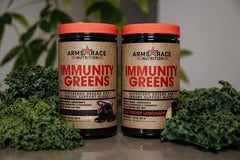 Arms Race Immunity Greens powder scoop blends quickly with a Pineapple Mango beverage