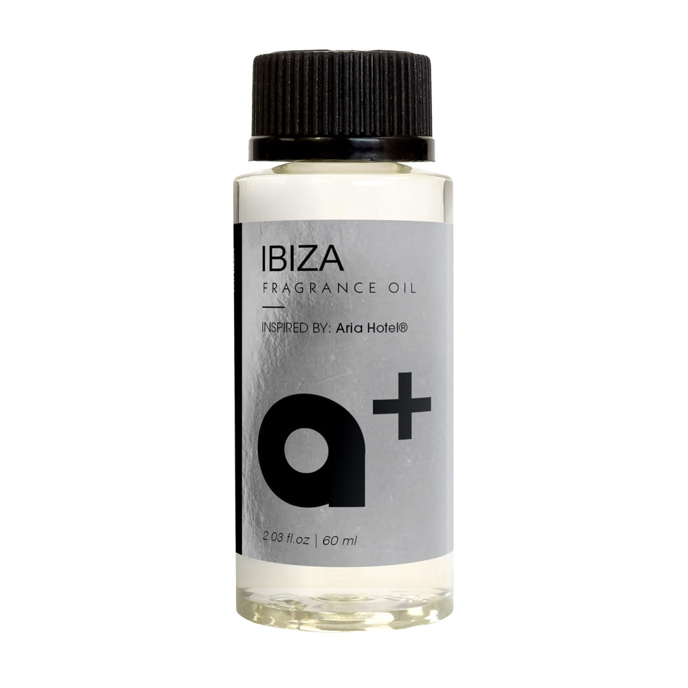 Aromar+ Ibiza bottle with amber, orange and vanilla notes for a refined home scent.