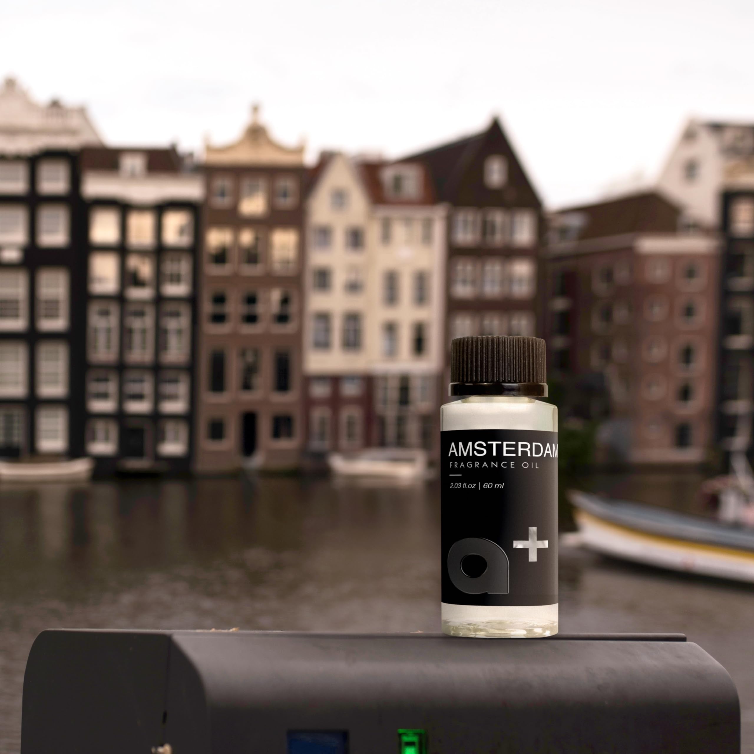 Aromar plus diffuser setup showcases Amsterdam scent for living spaces and offices.
