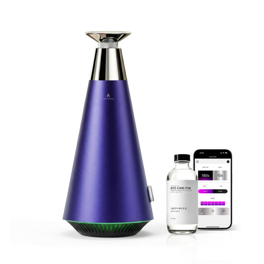 AROMASOUL waterless diffuser with alloy exterior and ambient glow for upscale spaces.