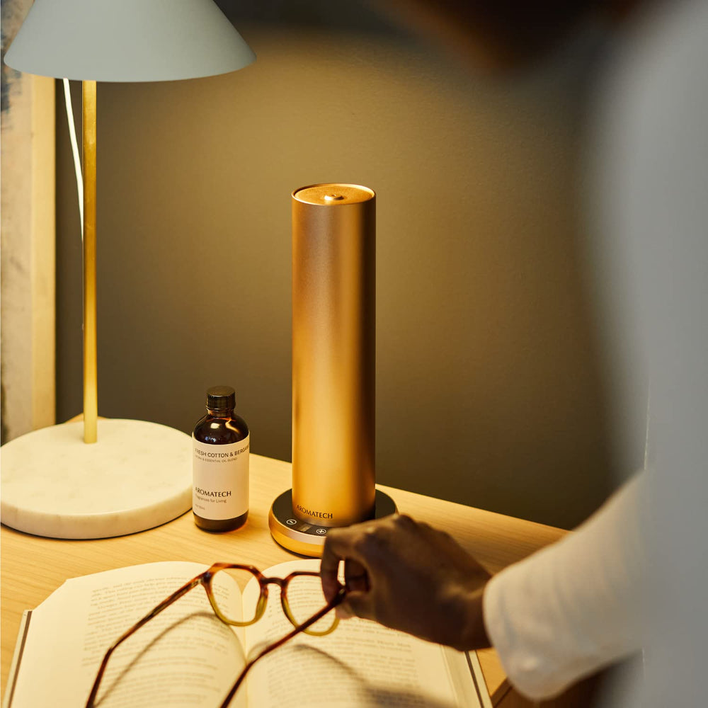 AromaTech diffuser in room setting demonstrating room-filling aroma.