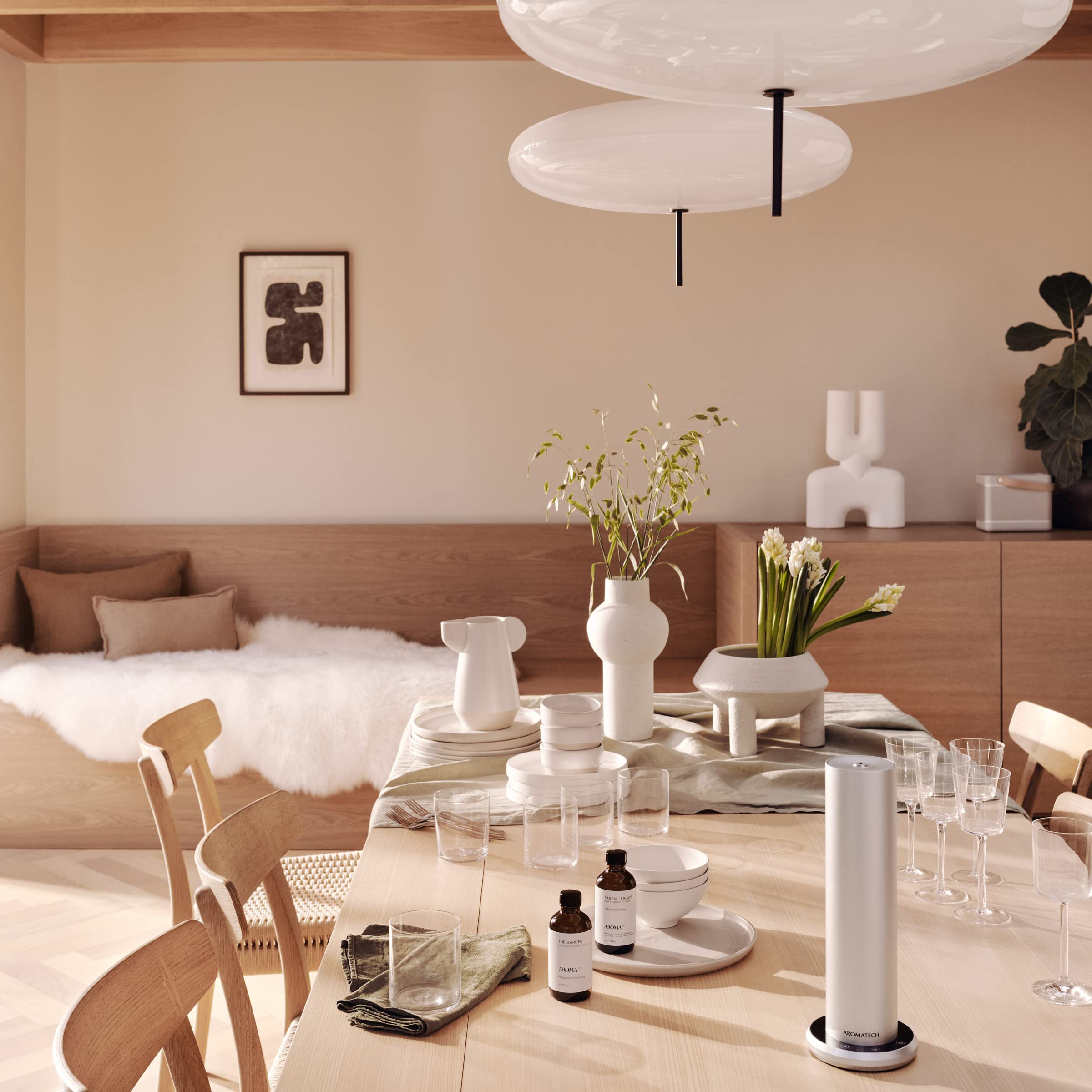 Aromatech The Garden aroma oil bottle pouring into diffuser for ambiance
