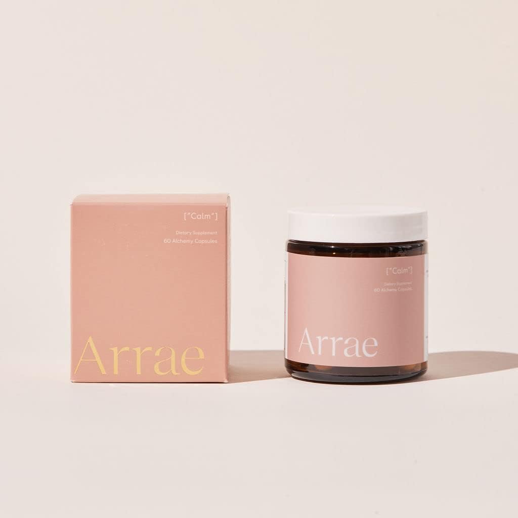 Arrae Calm capsules resting on a wooden desk with a calm vibe