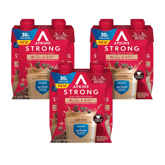 Atkins Strong Café Latte shake bottle on a kitchen countertop, high-protein convenience for busy mornings.