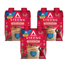 Atkins Strong Café Latte shake bottle on a kitchen countertop, high-protein convenience for busy mornings.