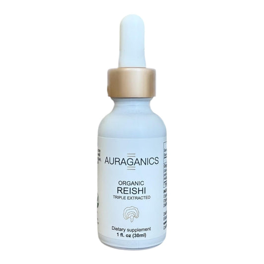 Dropper pours Reishi tincture from the amber bottle for stress relief and energy support.
