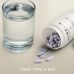 Glass of water beside Aurelia Skin Perfection bottle for easy daily use