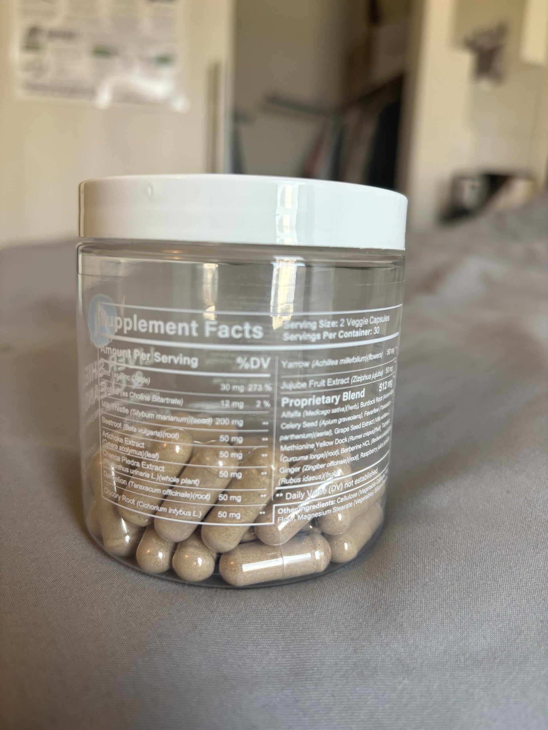 Avenir Liver Shield capsules arranged with fruits and greens for everyday wellness