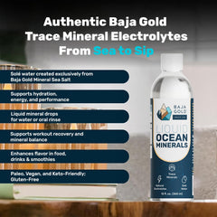 Baja Gold Liquid Mineral Drops dropper dispensing into a glass for enhanced minerals.