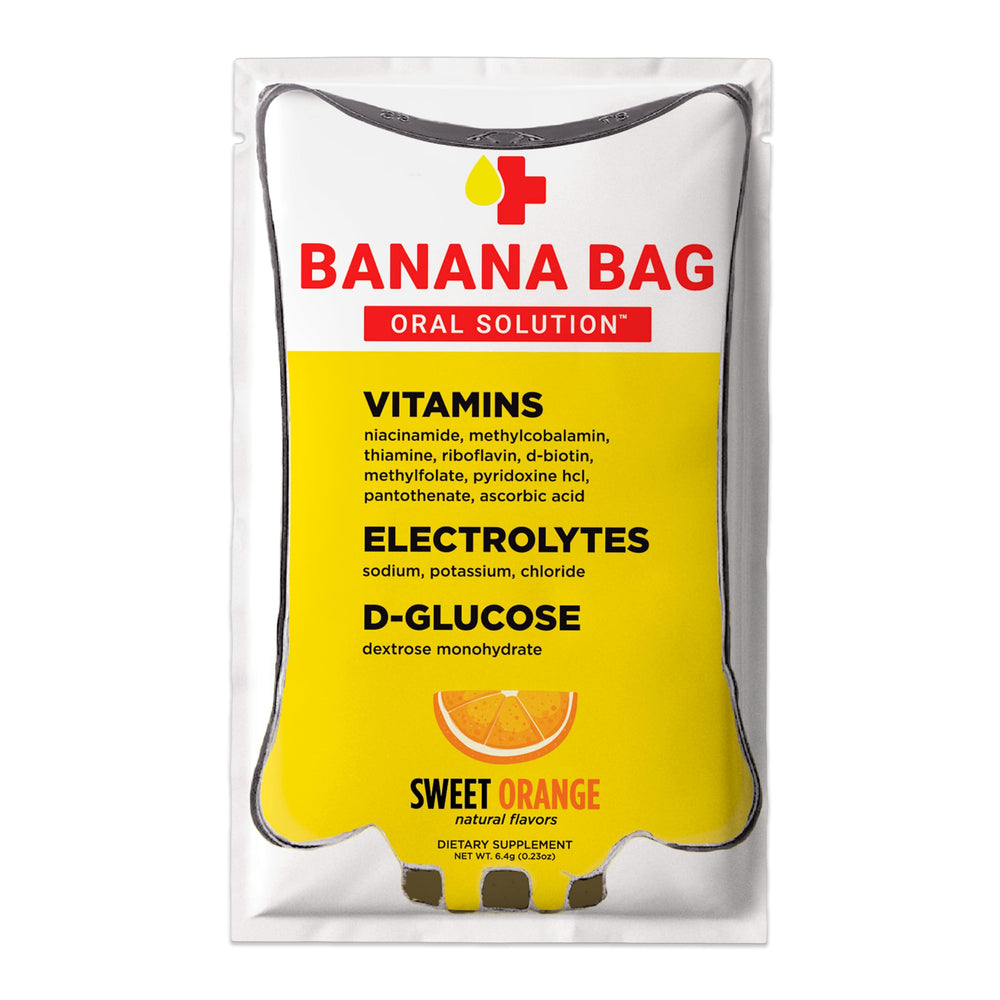 Banana Bag Sweet Orange packets dissolving in water for quick hydration