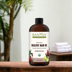 Banyan Botanicals Brahmi Oil 24 oz bottle on shelf highlighting sustainable sourcing.