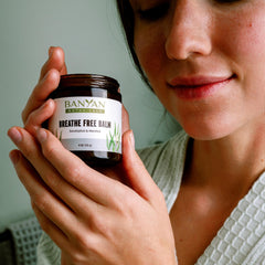 Ayurvedic herbs in Banyan Botanicals Breathe Free Balm pictured up close.