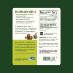 Powder scoop beside Banyan Botanicals packaging showing easy dosing.