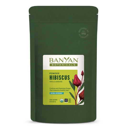 Banyan Botanicals Hibiscus Powder jar shows vibrant red petals, ideal for refreshing tea.