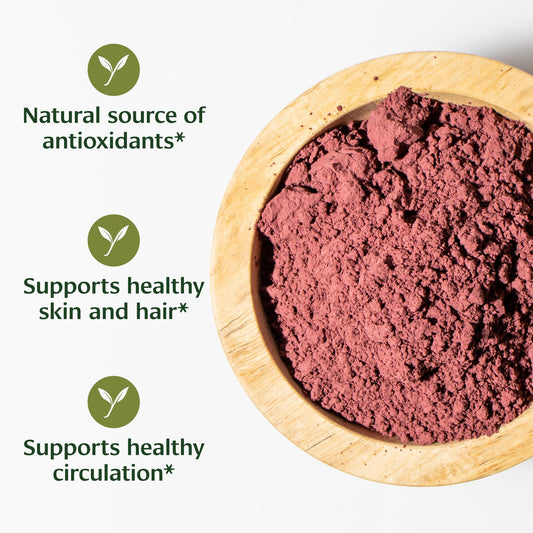 Scoop of Banyan Botanicals Hibiscus Powder for smoothies and tea infusions.