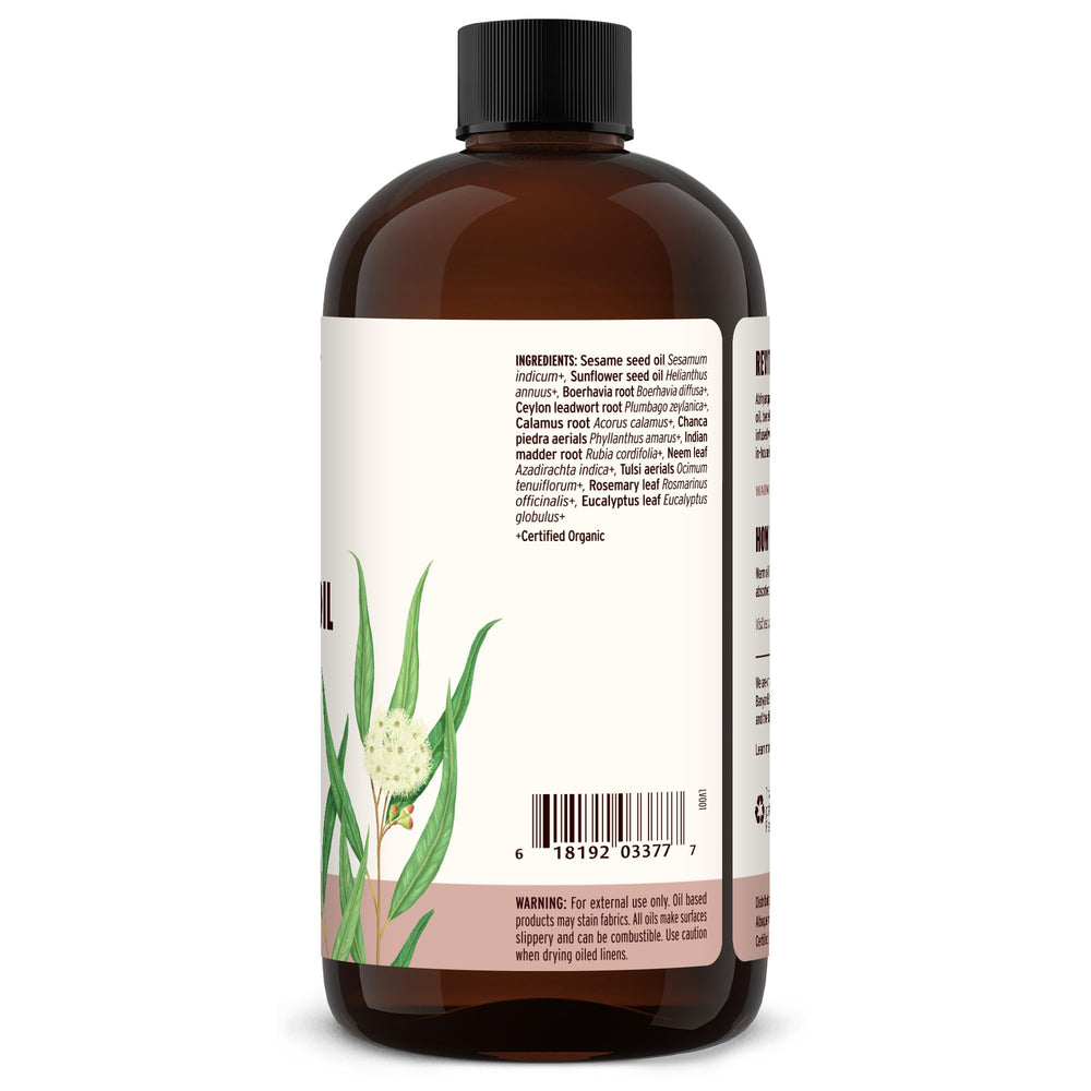 Close-up of Banyan Botanicals Kapha Massage Oil ingredients like tulsi and chitrak.