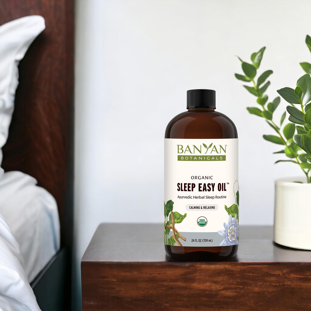 Banyan Botanicals Sleep Easy Oil applied to temples and soles for tranquil evening ritual