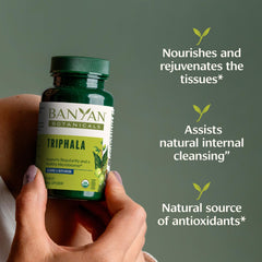 Banyan Botanicals Triphala tablets bottle pour showing easy daily use