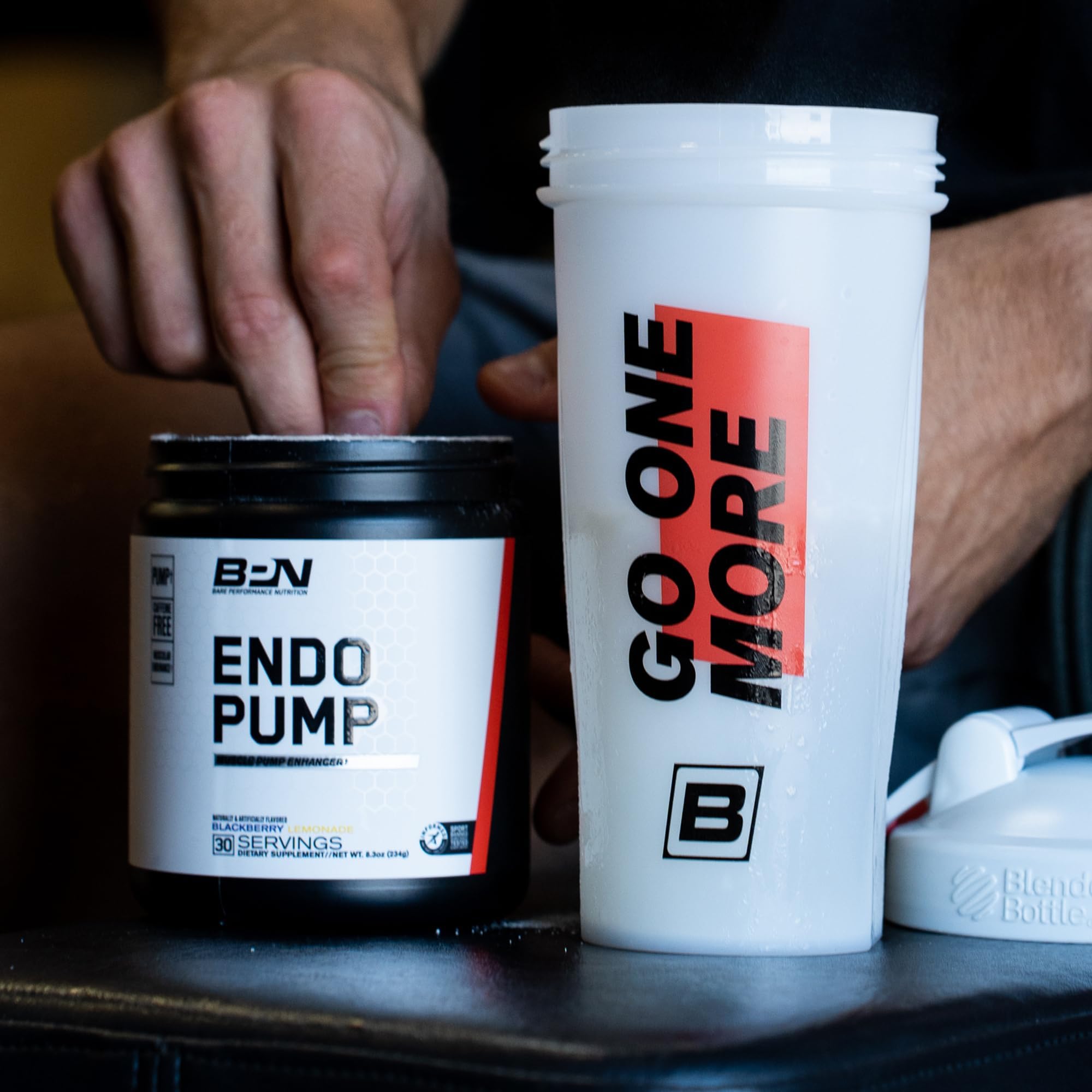 BARE PERFORMANCE NUTRITION EndoPump canister top with seal and mango accents for freshness.