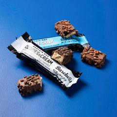 Barebells Cookies and Cream bar close-up, rich flavor and satisfying crunch.