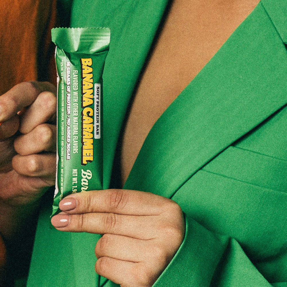 Barebells soft protein bar in hand for a quick snack