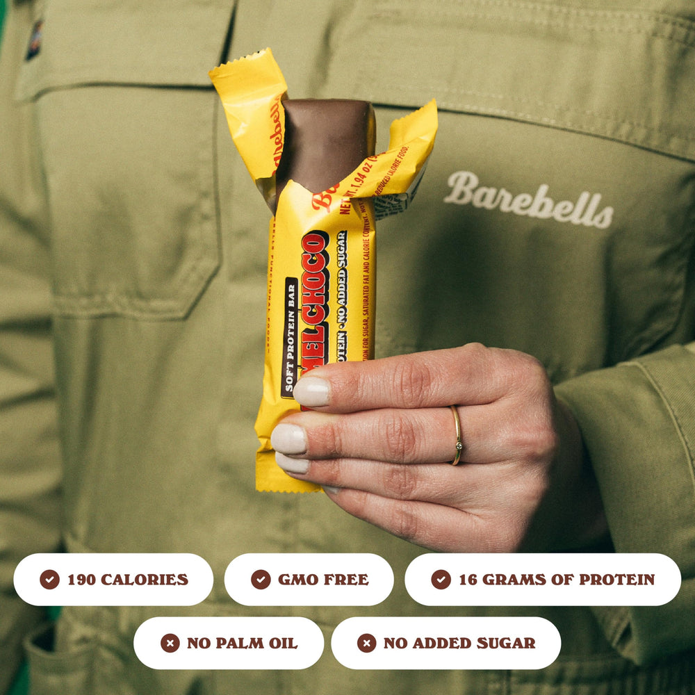 Barebells Soft Protein Bar Caramel Choco bite revealing fluffy interior and chocolate coating.