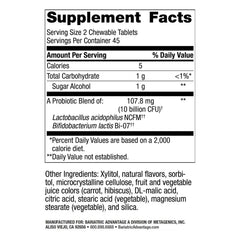 Chewable FloraVantage tablet held in hand for convenient gut health support.