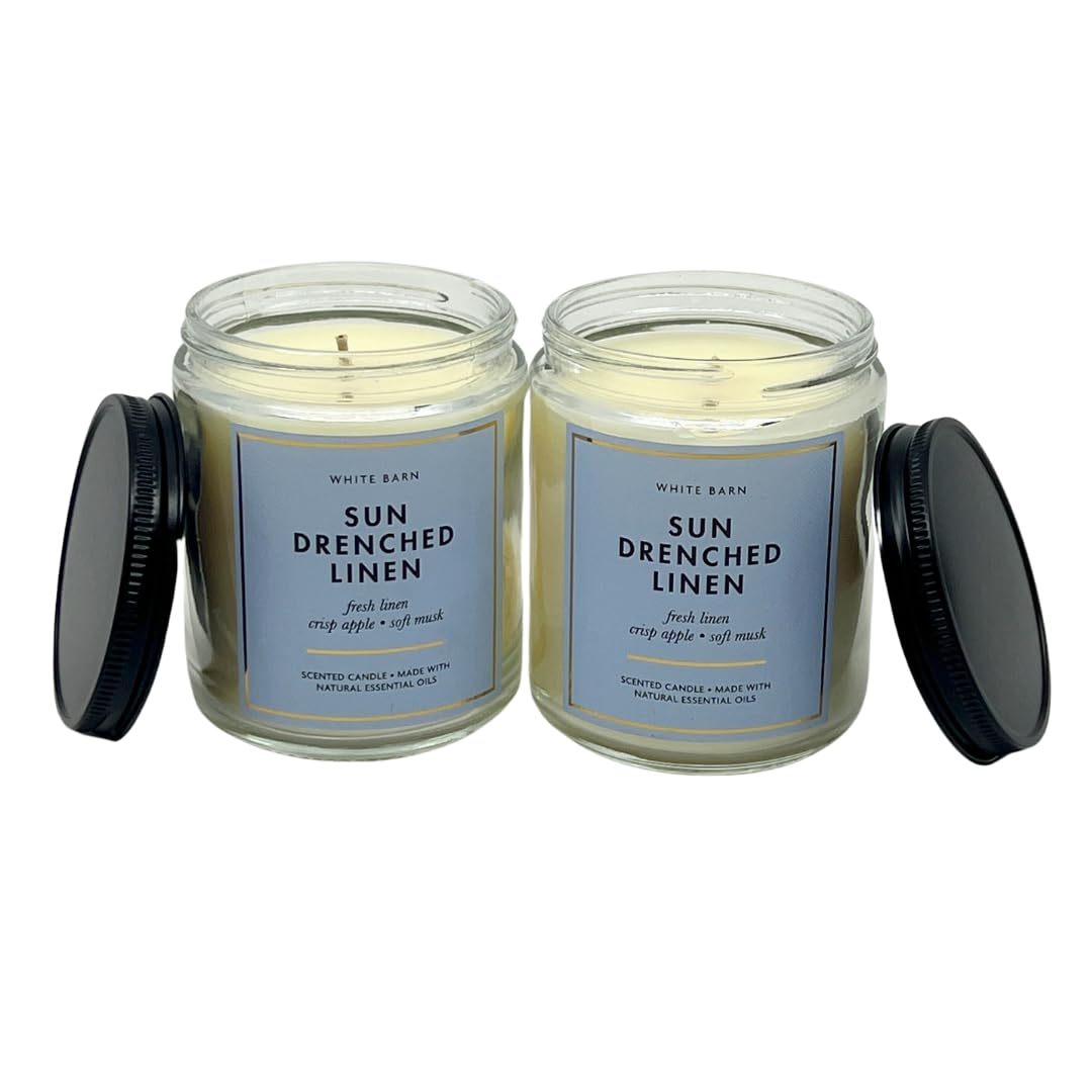 Bath & Body Works Sun Drenched Linen candle on shelf conveys bright, uplifting ambiance.