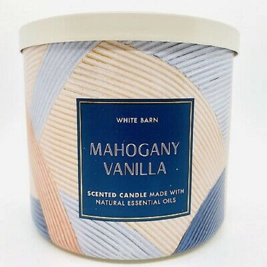 Bath & Body Works White Barn 3-Wick candle jar glow creates cozy ambience in home decor.