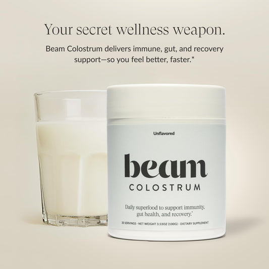 Beam Colostrum Powder close-up on jar highlights purity for immune support.