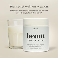 Beam Colostrum Powder close-up on jar highlights purity for immune support.