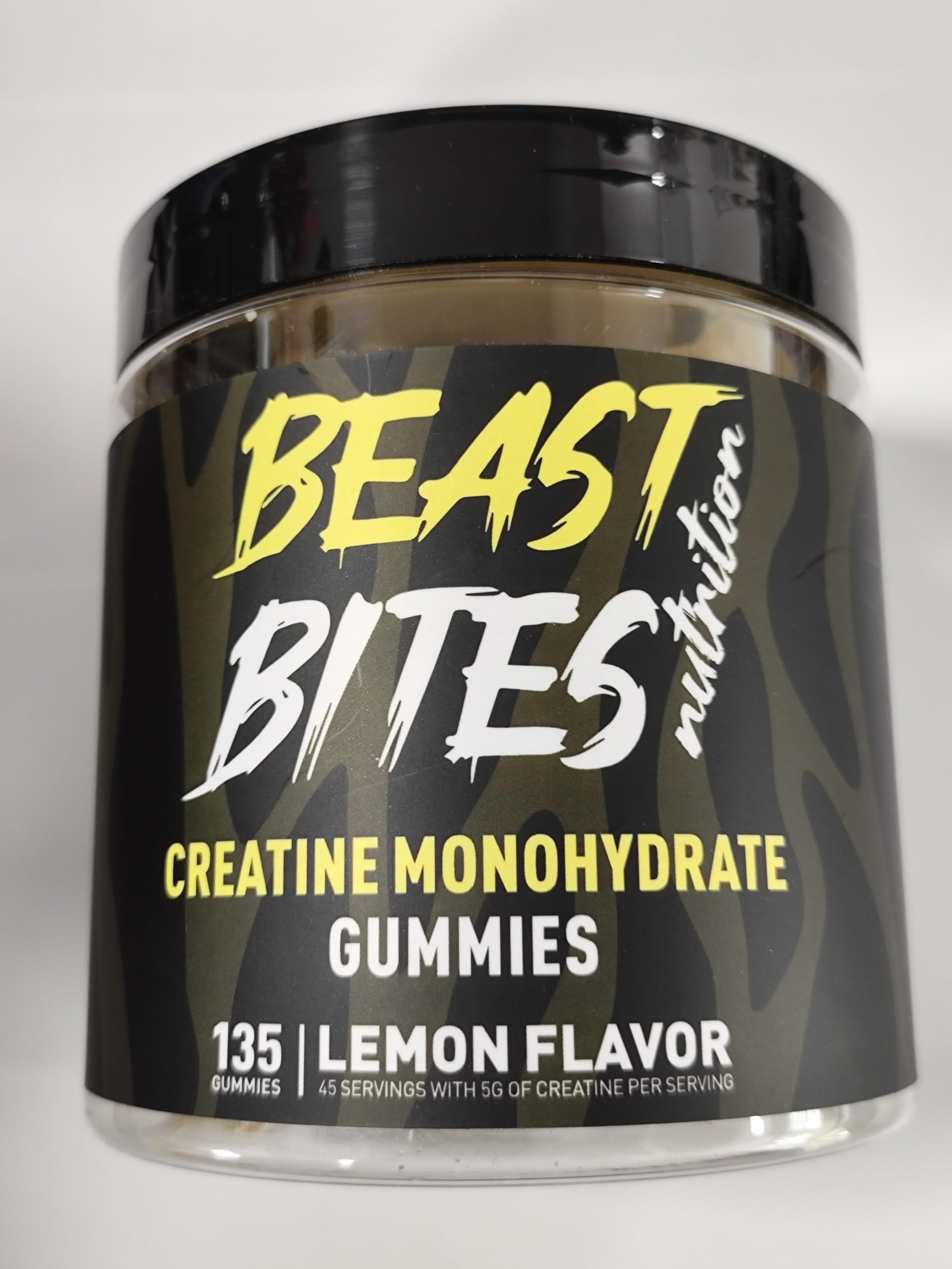 BEAST BITES Creatine Gummies lemon bottle close-up for convenient daily performance support.