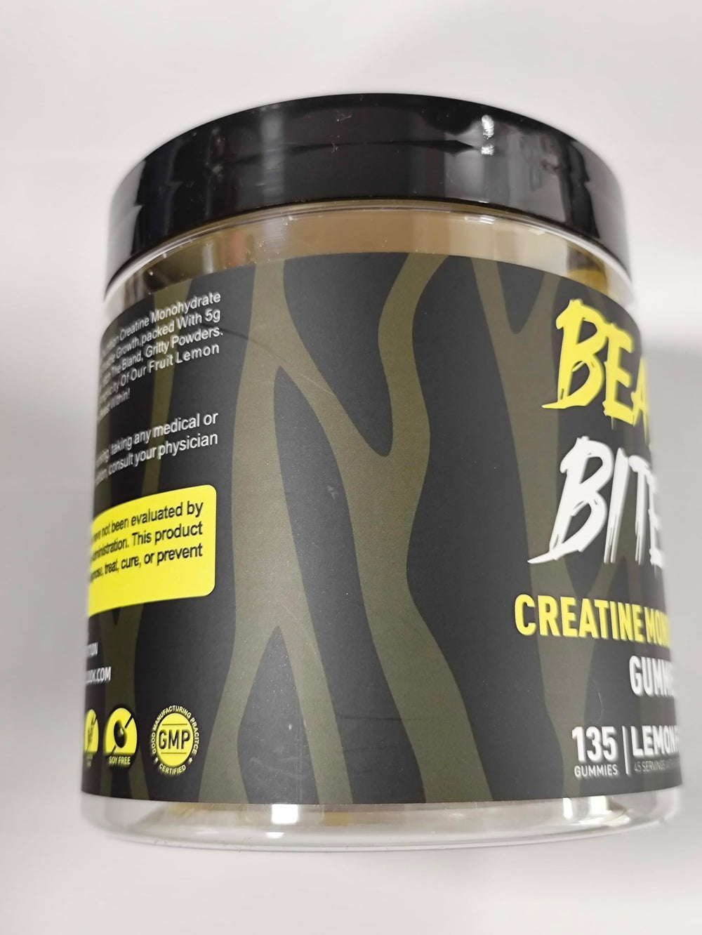 BEAST BITES Creatine Gummies lemon close-up reveals chewy texture and zesty lemon flavor.