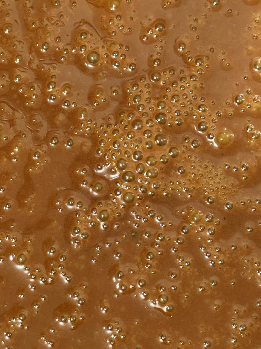 Beeghee spoonful serving reveals creamy texture ideal for daily intake.