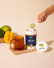 Bella All Natural Detox Powder Mango glass with drink highlighting gentle digestion