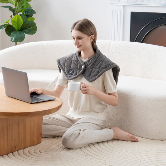 Berkshire Blanket heating pad worn on the shoulder for relaxing warmth.