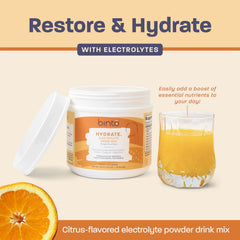Powder pouring into water to create a refreshing citrus hydration.