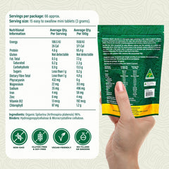 Biogenesis Spirulina mini tablets being poured for quick daily use.