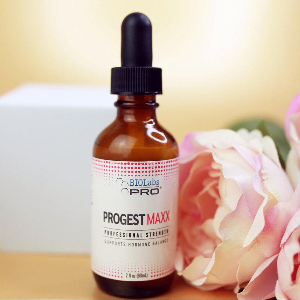 Hand applying Progest MAXX oil in routine