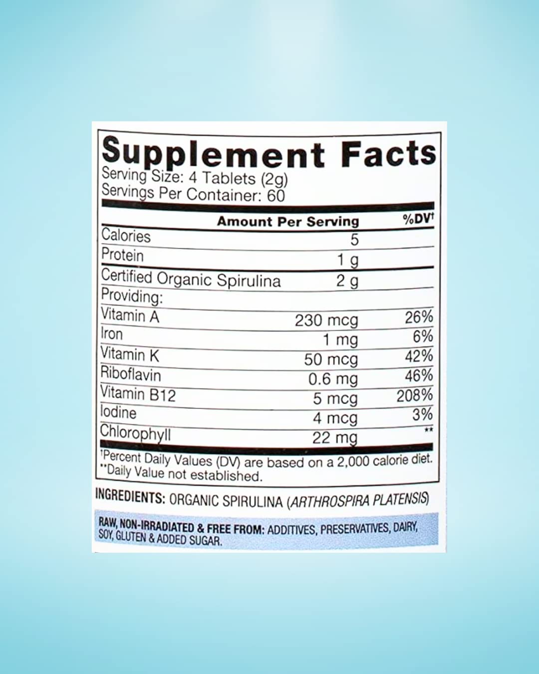 BioOptimal spirulina tablets pills closeup, showing pure, additive-free texture.