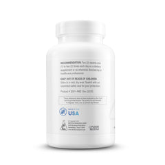 Biotics Research Thyrostim bottle on wood conveys USA-made quality and safety.