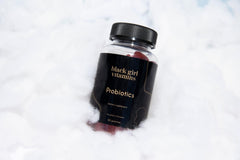 Black Girl Vitamins probiotic gummies in a morning routine setup.