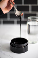 Black Lotus Shilajit Resin dissolving in water for daily energy