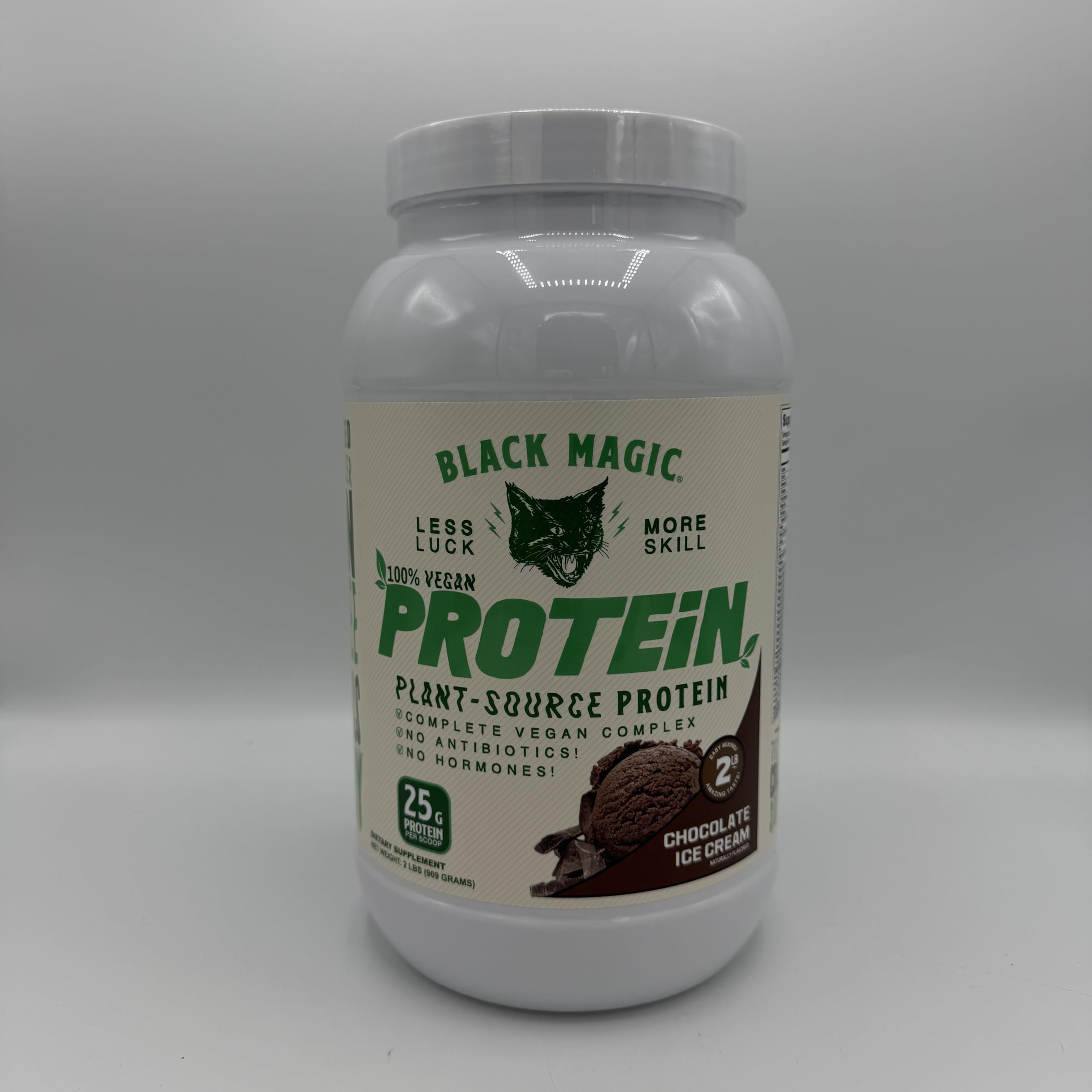 Black Magic vegan protein tub on counter, keto-friendly with low sugar