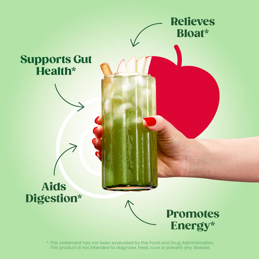 Bloom Nutrition Greens Powder tub label close-up emphasizes clean ingredients for gut-friendly daily wellness